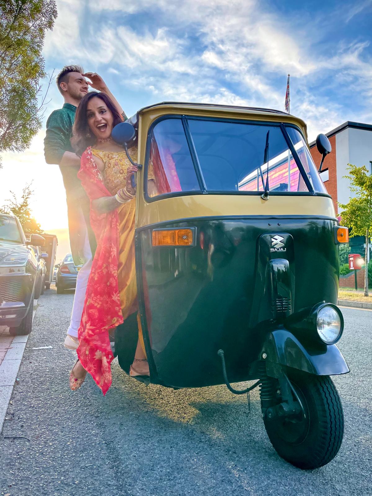 Krishna and Matt arriving in their wedding rickshaw